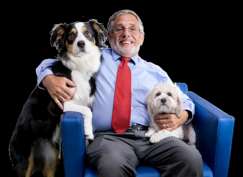 Dr. Joe Roetheli with two dogs
